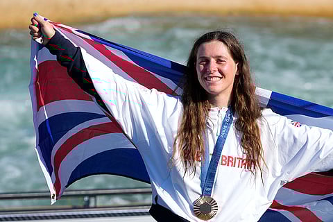 Women's kayak cross medal ceremony: Bronze medalist Kimberley Woods of Britain